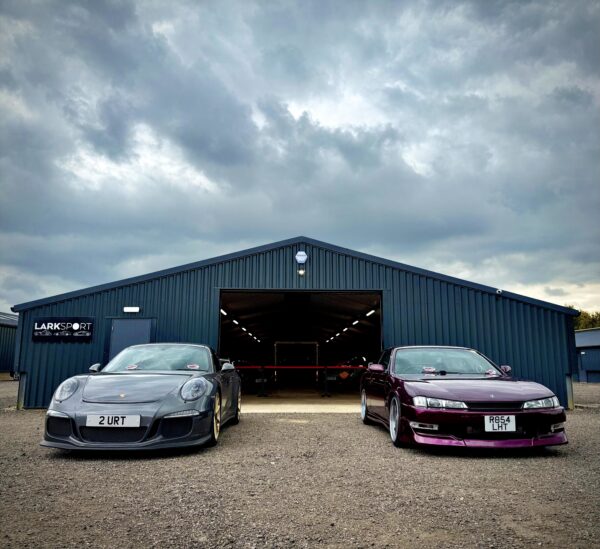 Larksport storage with two cars parks at the front